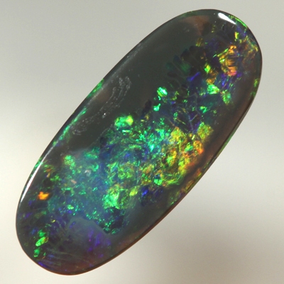 SOLID BLACK OPAL Bright sparkles of orange and green with a touch blue